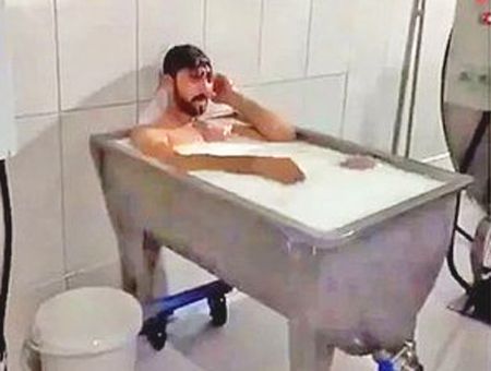 Turkey, worker bathing in milk