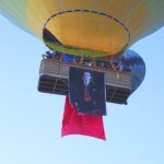Turkey, balloons in Cappadocia with flags and portraits of Atatürk