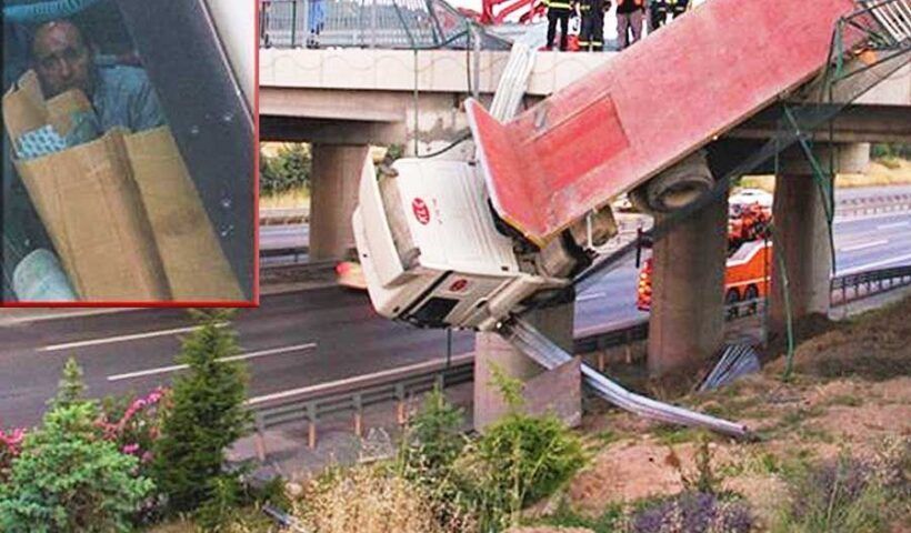 Turkey, truck driver hanging in a bridge