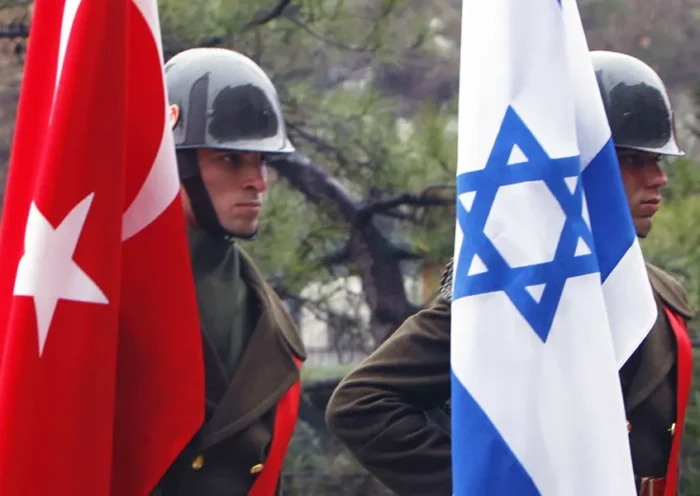 Turkish soldiers with flags of Turkey and Israel