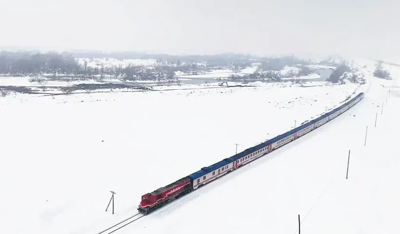the Orient Express crossing a snowy landscape