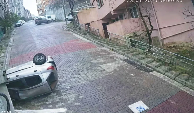 a car overturned on a sloping street in Istanbul after a serious accident