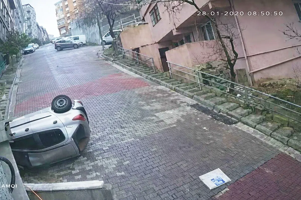 a car overturned on a sloping street in Istanbul after a serious accident