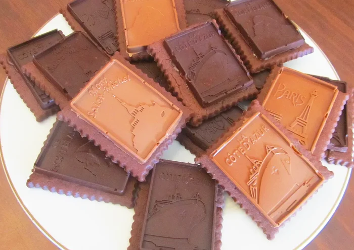 a plate with cocoa biscuits with dark and milk chocolate