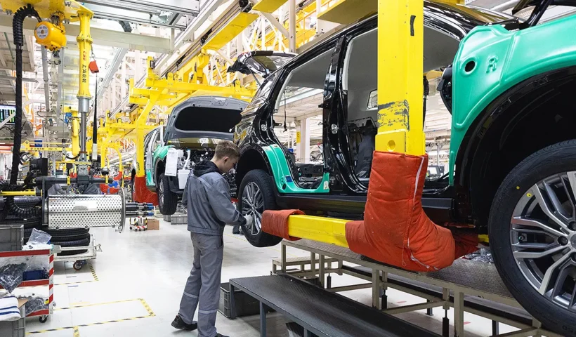 operator working in a car assembly factory