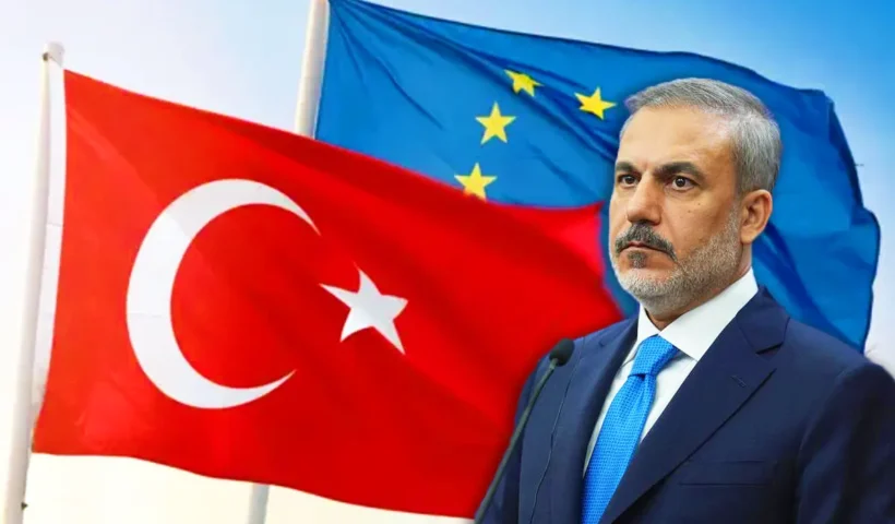 Turkish Foreign Minister Hakan Fidan with the EU-Turkey flag in the background