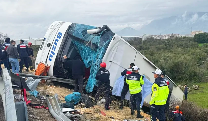 A bus overturned off the road surrounded by emergency crews after an accident in Antalya, Turkey.