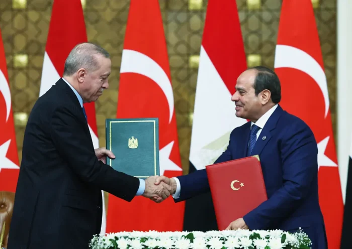 Turkish President Tayyip Erdogan and Egyptian President Al-Sisi shake hands after signing several agreements in Cairo.