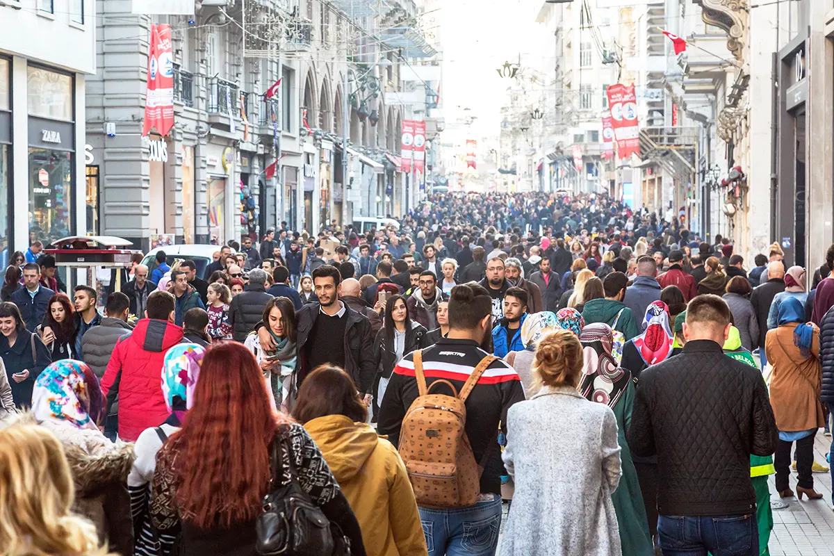 Istanbul's population: hundreds of people walking along the famous Istiklal Avenue.