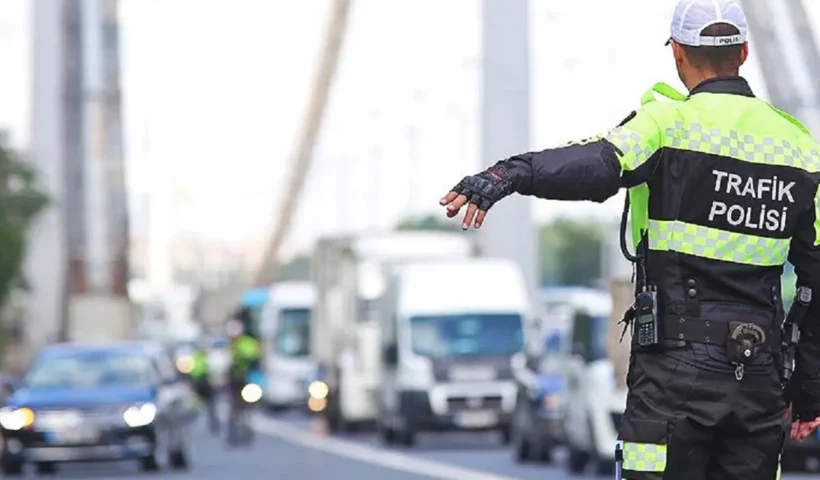 a Turkish traffic policeman ordering a vehicle to stop on one of the bridges across the Bosphorus in Istanbul.