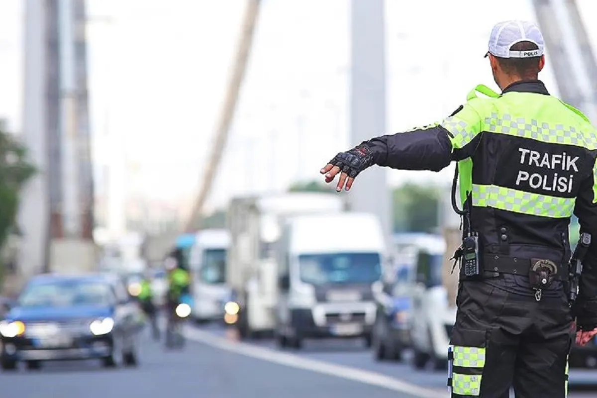 a Turkish traffic policeman ordering a vehicle to stop on one of the bridges across the Bosphorus in Istanbul.