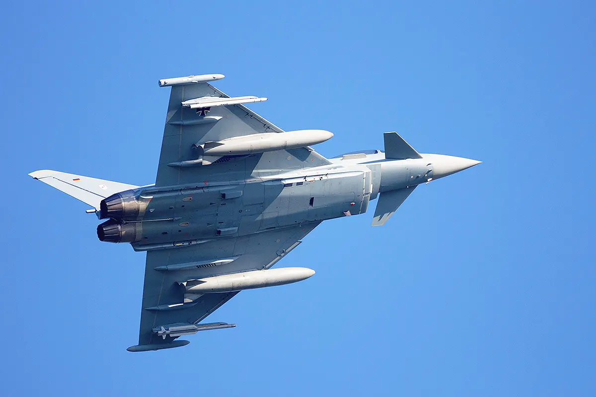 a German Eurofighter Typhoon fighter jet manoeuvring in the air showing the lower fuselage