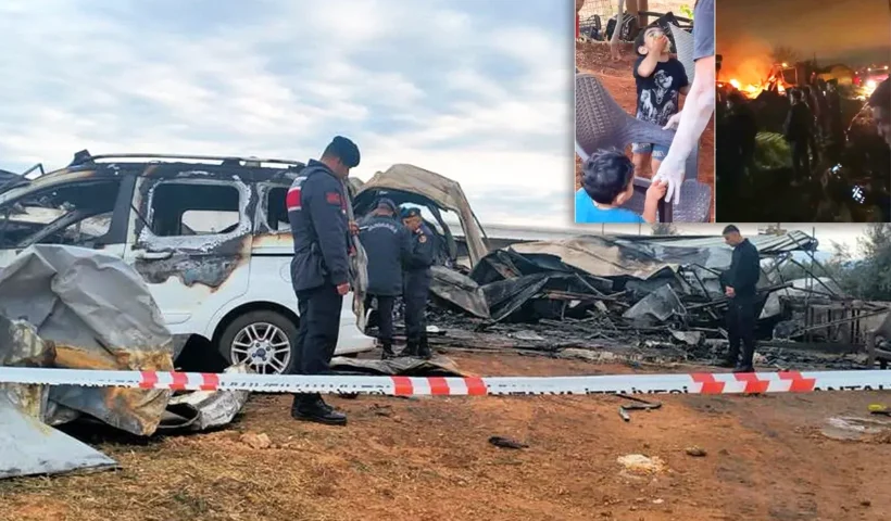 Turkish gendarmes inspect the scene of a fire next to the charred remains of a car and a container, with a photo of the dead children in one corner.