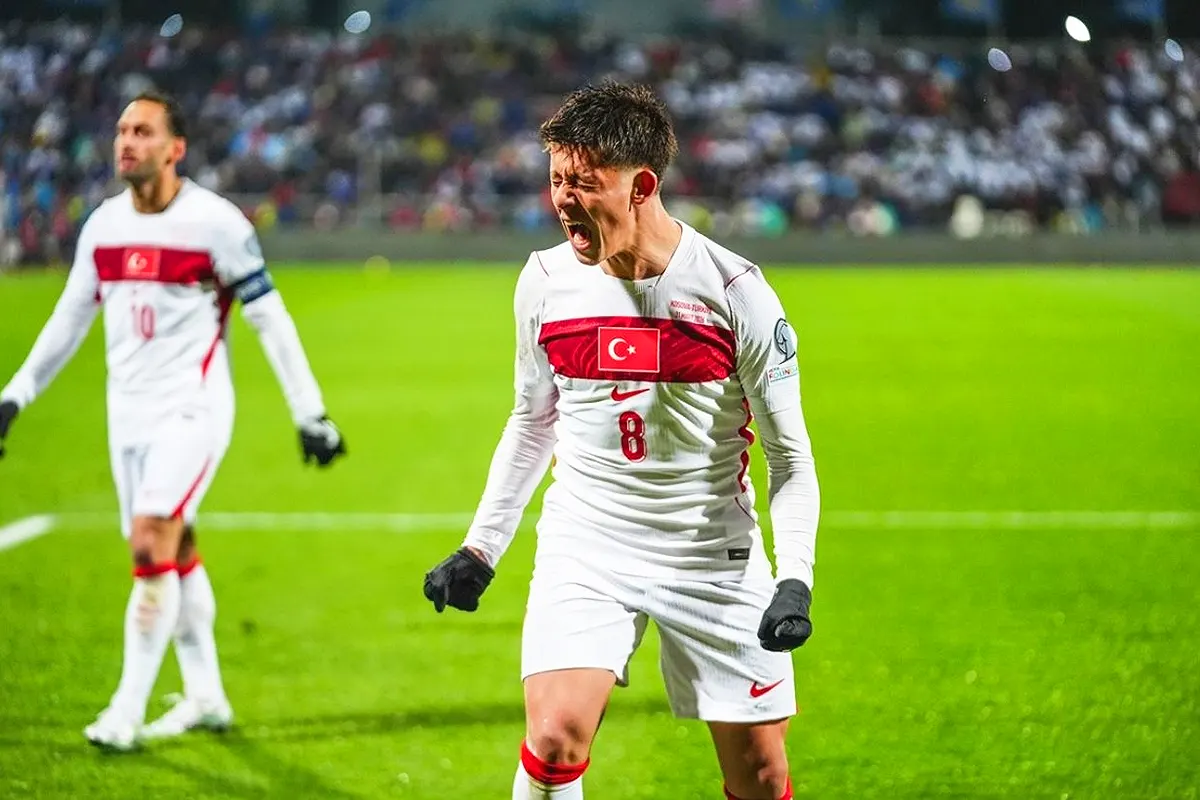 Arda Güler celebrates on the pitch wearing the Turkish national team shirt