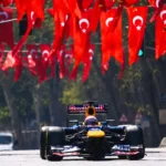 A Red Bull Formula 1 single-seater race car is cruising through the streets of Istanbul