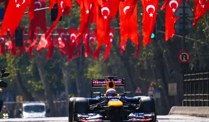 A Red Bull Formula 1 single-seater race car is cruising through the streets of Istanbul