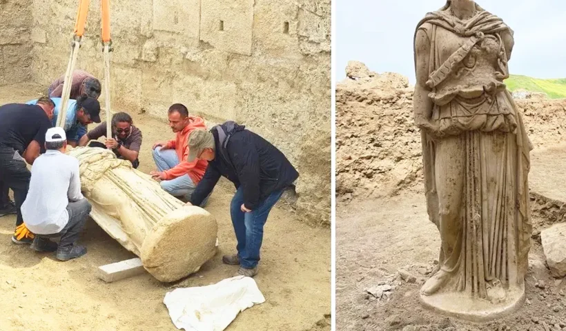 arqueólogos levantan una estatua enorme de la diosa Atenea desprovista de cabeza