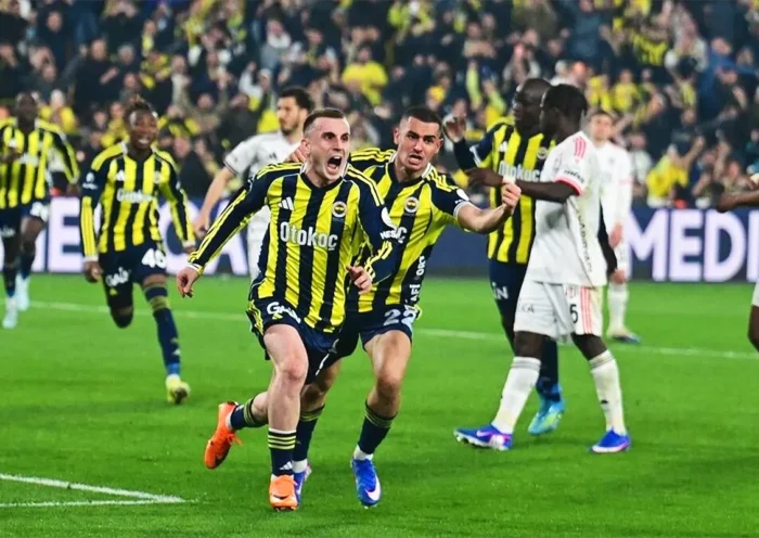 Fenerbahçe players celebrate wildly after scoring a goal during a match against Beşiktaş
