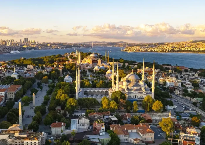 A view from the Fatih district, showing Istanbul's historic center with the Blue Mosque in the foreground and Hagia Sophia and the Bosphorus in the background