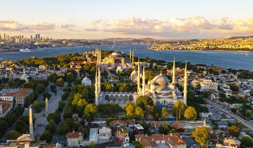 A view from the Fatih district, showing Istanbul's historic center with the Blue Mosque in the foreground and Hagia Sophia and the Bosphorus in the background