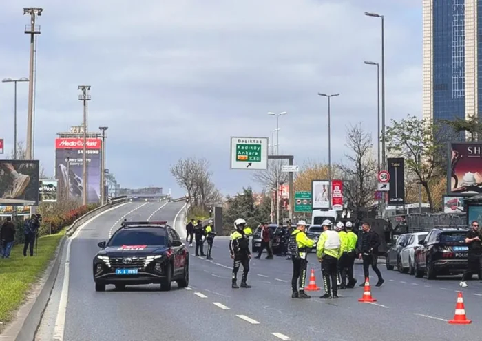 several police officers on an avenue in Istanbul's Levent financial district amid a major security operation