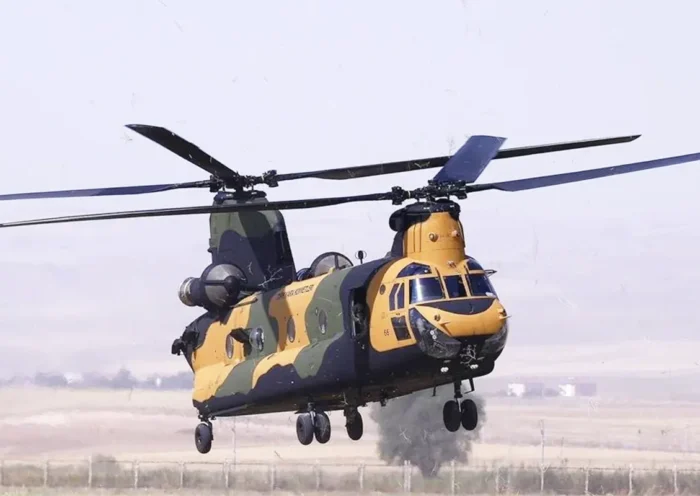 a Turkish CH-47 military helicopter in military livery flying