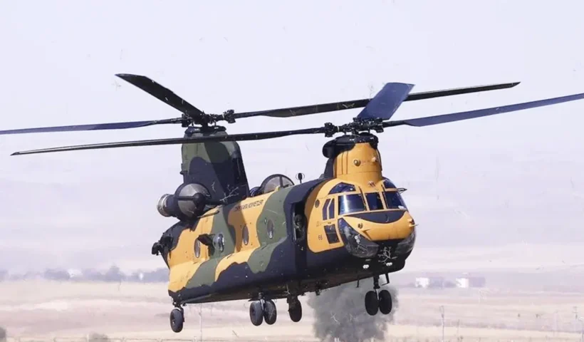 a Turkish CH-47 military helicopter in military livery flying