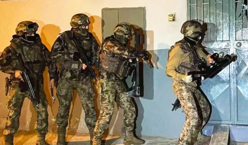 Heavily armed Turkish special security forces attempting to enter a house