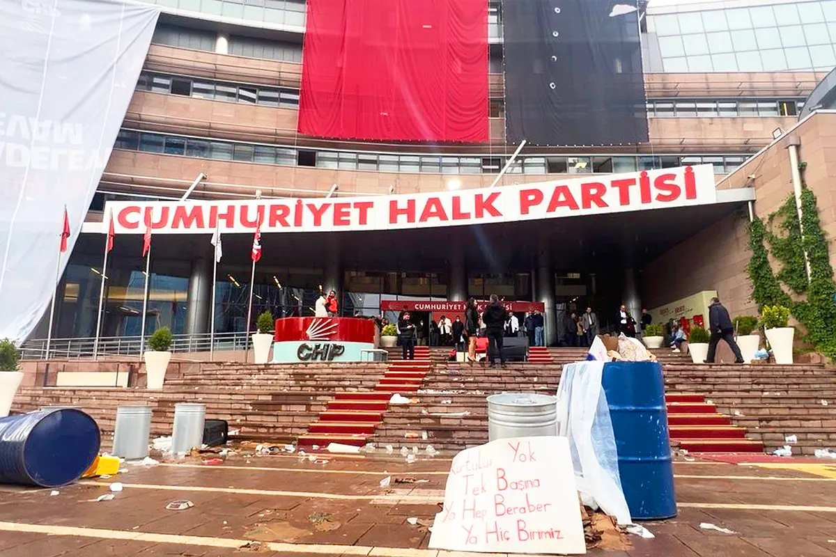 Images of the CHP party headquarters in Ankara following the police raid, showing the stairwell littered with remnants of banners and other objects