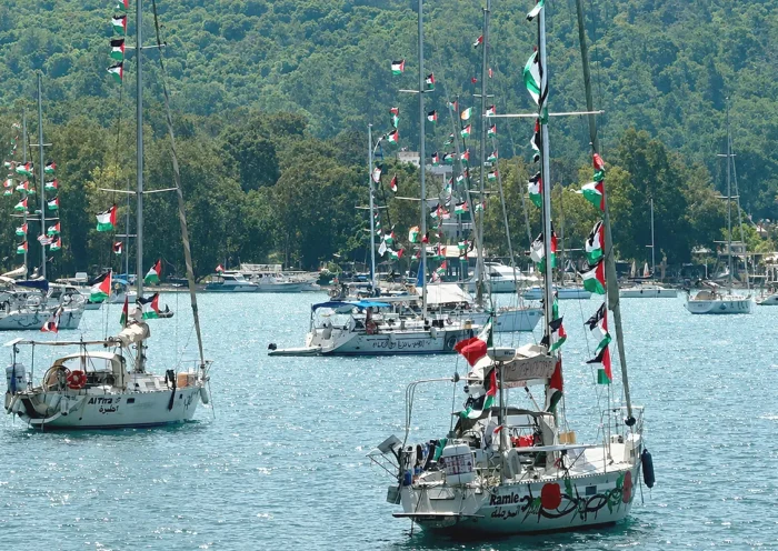 Ships from the Global Sumud Flotilla flying Palestinian flags anchored in a Turkish port