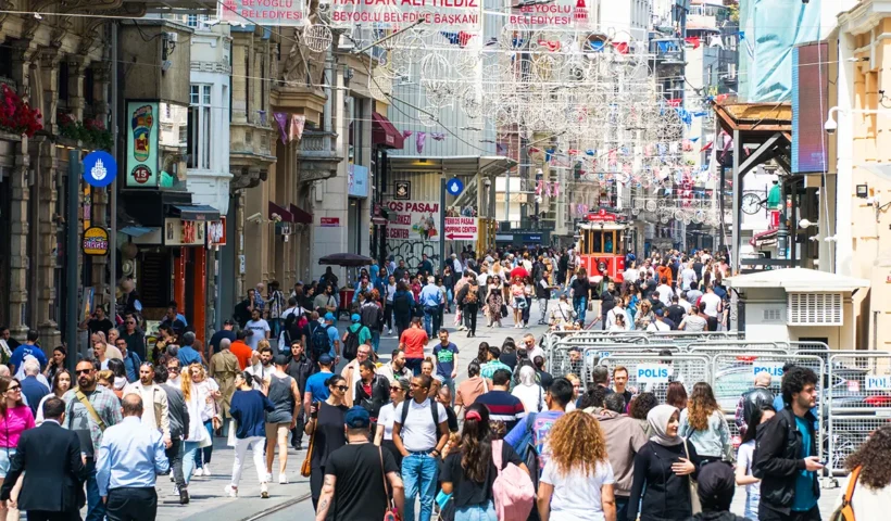 hundreds of people walking along Istanbul’s Istiklal Avenue
