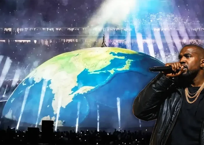 Kanye West on a giant globe during his concert in Istanbul; in the foreground, a photo of the artist