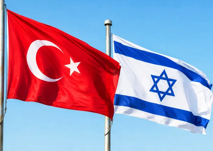 two flagpoles flying the flags of Turkey and Israel
