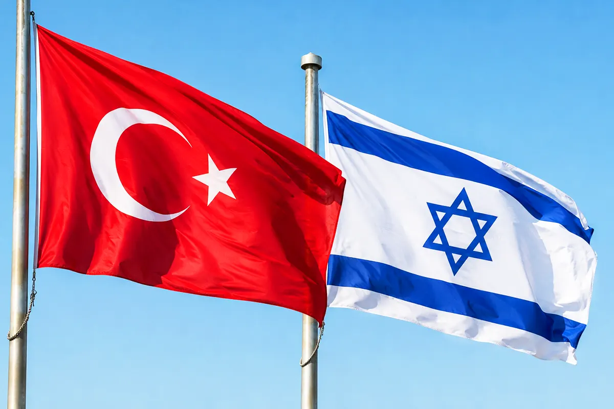 two flagpoles flying the flags of Turkey and Israel
