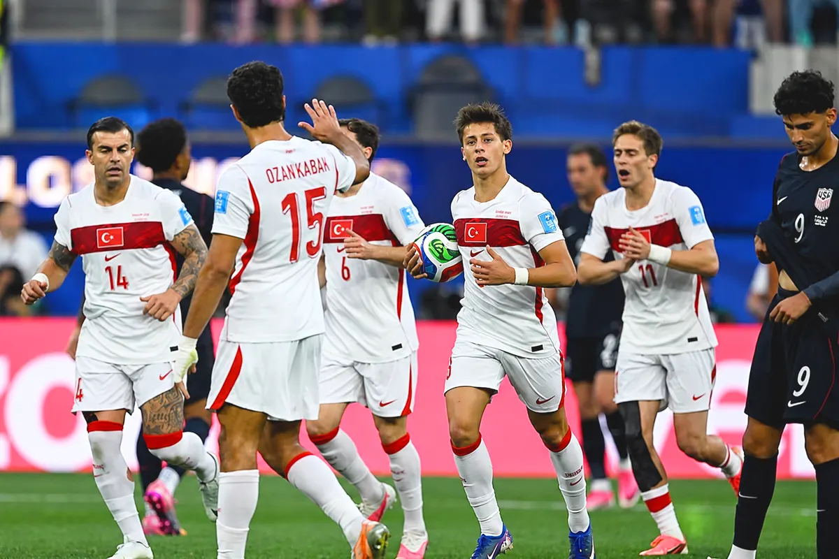 Turkish players, including Arda Güler, celebrate a goal against the United States at the World Cup