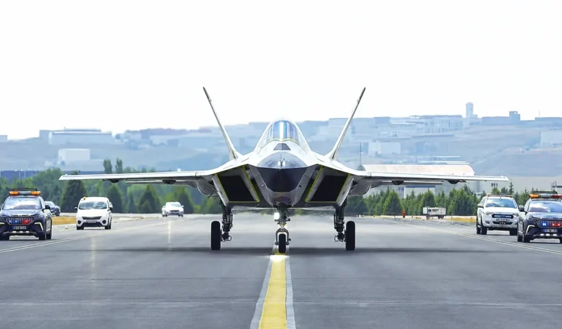 a front view of a prototype of the Turkish KAAN fighter jet taxiing down a runway