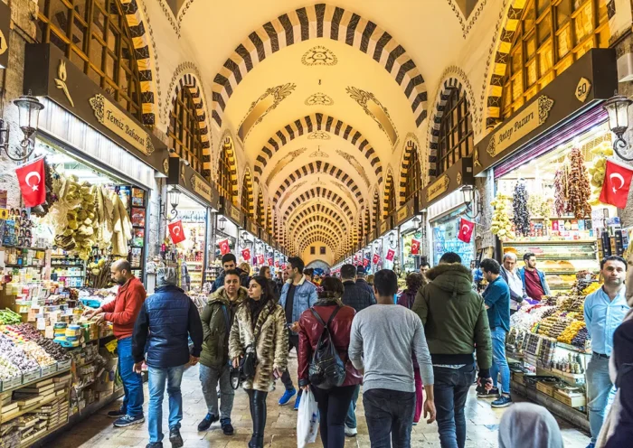 tourists and customers walking through the Egyptian Bazaar in Istanbul