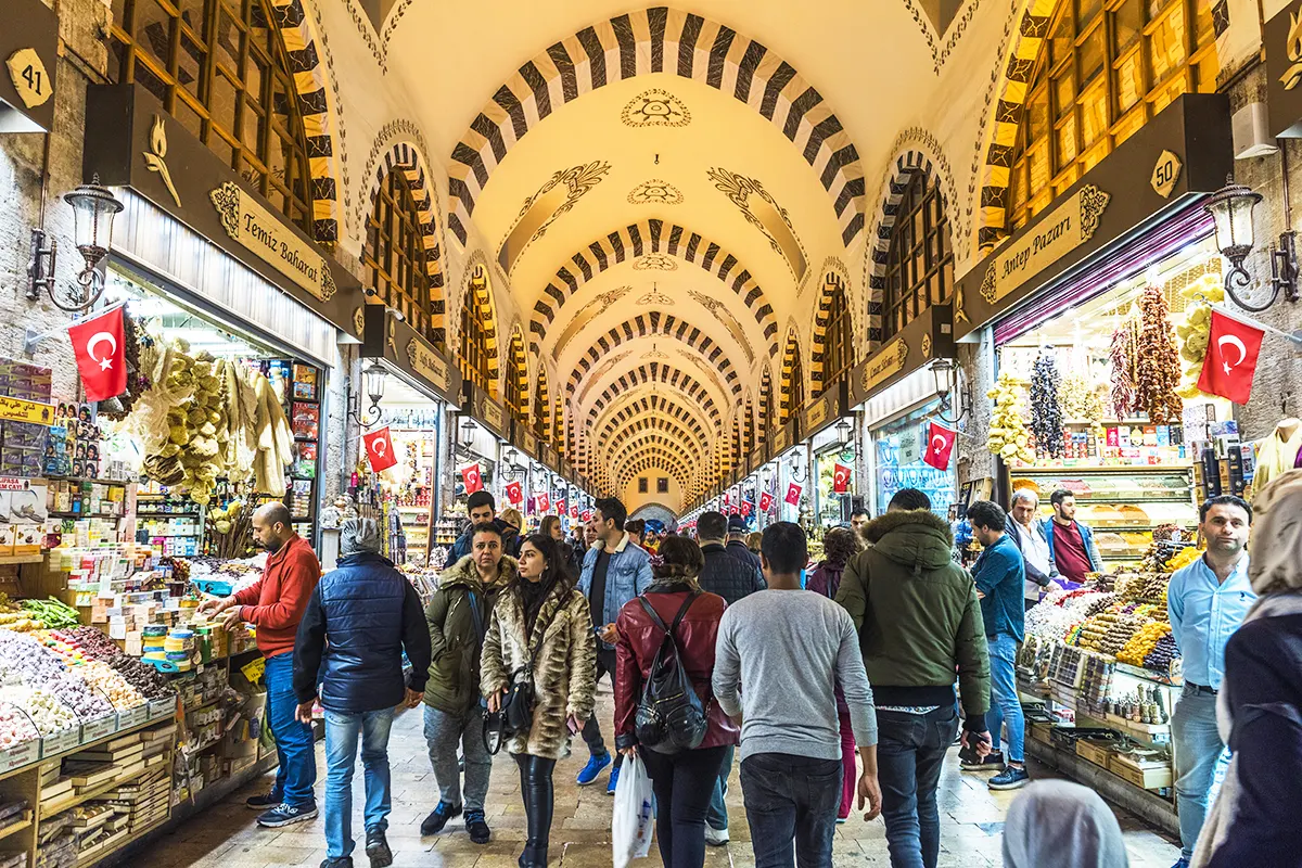 tourists and customers walking through the Egyptian Bazaar in Istanbul